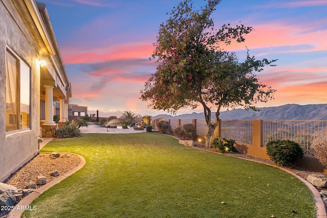 yard at dusk with a mountain view