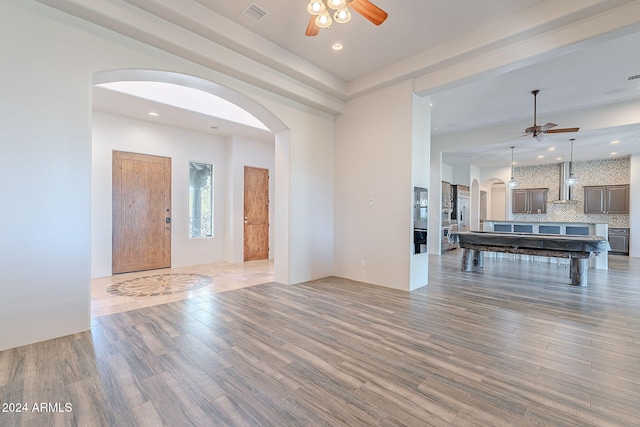 foyer featuring ceiling fan and hardwood / wood-style floors