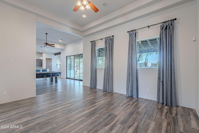 spare room featuring hardwood / wood-style flooring, ceiling fan, and pool table