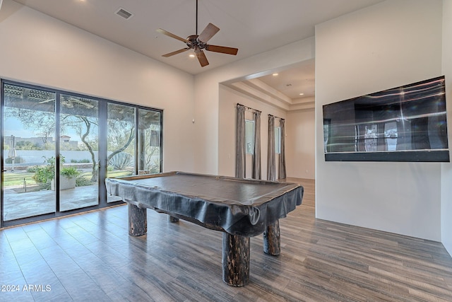 playroom featuring wood-type flooring, a towering ceiling, ceiling fan, and billiards