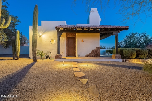 7845 E Dynamite Blvd, Scottsdale, AZ 85266 - view of front of property featuring stucco siding, a tiled roof, and a chimney