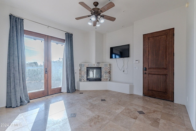 7845 E Dynamite Blvd, Scottsdale, AZ 85266 - unfurnished living room with french doors, a ceiling fan, and a multi sided fireplace