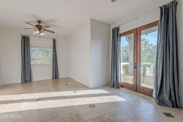 spare room with french doors and ceiling fan