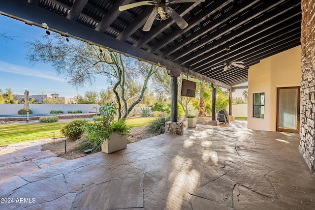 view of patio featuring ceiling fan