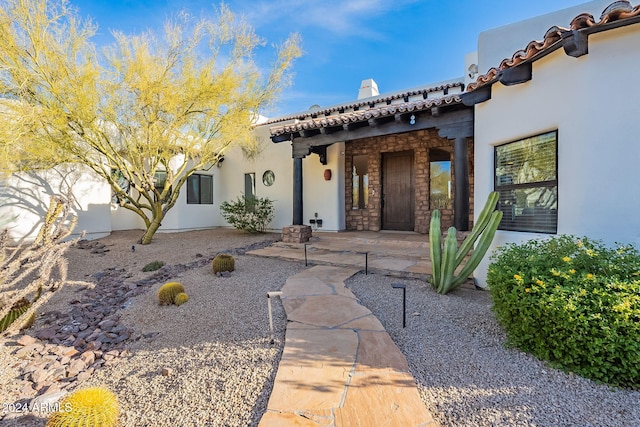 7845 E Dynamite Blvd, Scottsdale, AZ 85266 - entrance to property featuring stucco siding and a chimney
