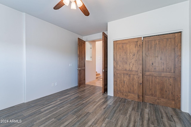 7845 E Dynamite Blvd, Scottsdale, AZ 85266 - unfurnished bedroom with dark wood finished floors, a closet, and ceiling fan