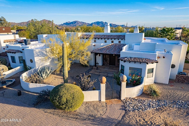 7845 E Dynamite Blvd, Scottsdale, AZ 85266 - mediterranean / spanish home with a gate, a mountain view, a fenced front yard, and stucco siding