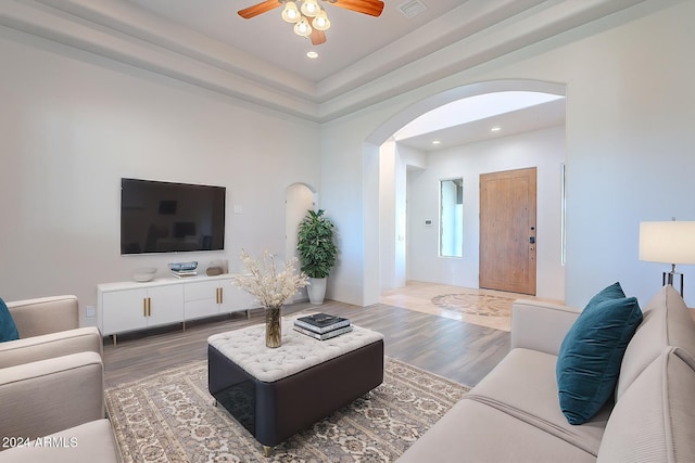 7845 E Dynamite Blvd, Scottsdale, AZ 85266 - living area with arched walkways, a ceiling fan, recessed lighting, and wood finished floors