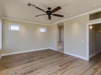3634 N Desert Oasis, Mesa, AZ 85207 - unfurnished bedroom featuring crown molding, arched walkways, baseboards, wood finished floors, and ensuite bath