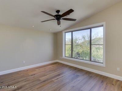 3634 N Desert Oasis, Mesa, AZ 85207 - spare room with vaulted ceiling, baseboards, a ceiling fan, and wood finished floors