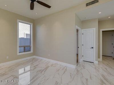 3634 N Desert Oasis, Mesa, AZ 85207 - unfurnished room featuring marble finish floors, ceiling fan, baseboards, and recessed lighting