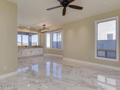 3634 N Desert Oasis, Mesa, AZ 85207 - spare room with baseboards, a chandelier, light marble finish floors, and recessed lighting