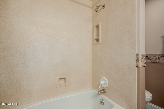 bathroom with toilet and shower / tub combination