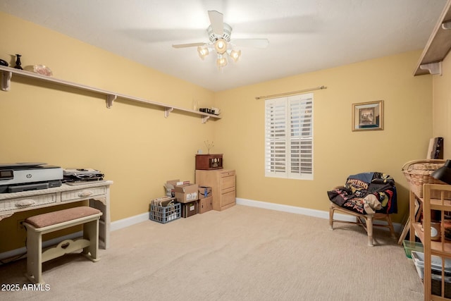 miscellaneous room with baseboards, a ceiling fan, and carpet floors