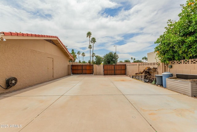 view of patio / terrace featuring fence and a gate