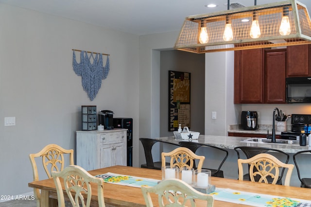 dining space featuring sink