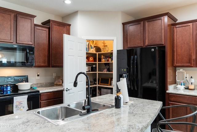 kitchen with black appliances and sink