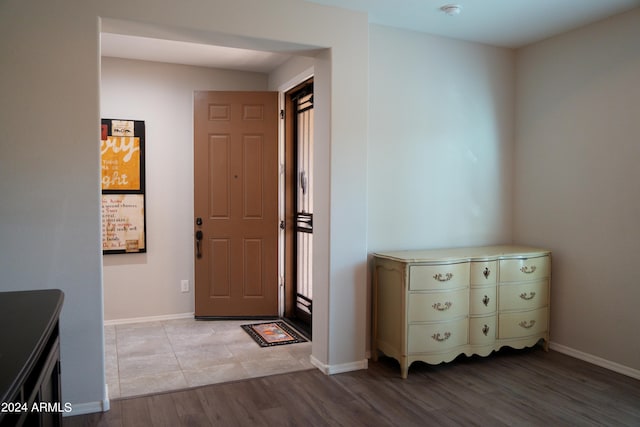 entrance foyer featuring light hardwood / wood-style floors and a healthy amount of sunlight