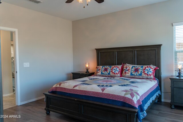 bedroom with ceiling fan and dark wood-type flooring