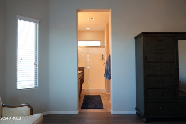 hall with wood-type flooring