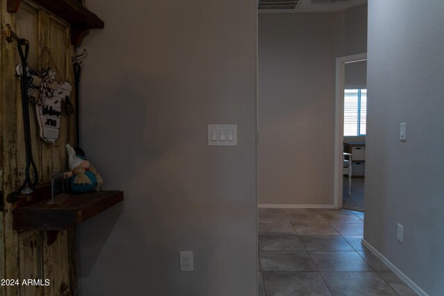 hall featuring tile patterned floors