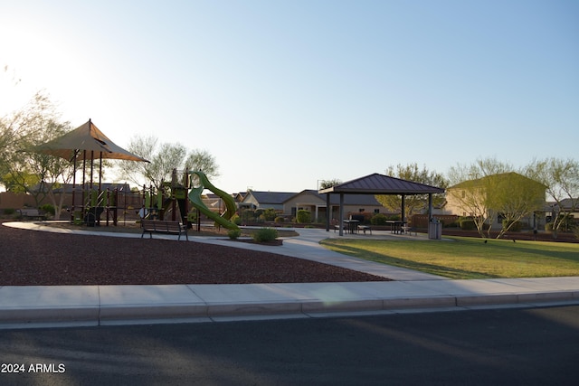 view of front facade featuring a front lawn, a playground, and a gazebo