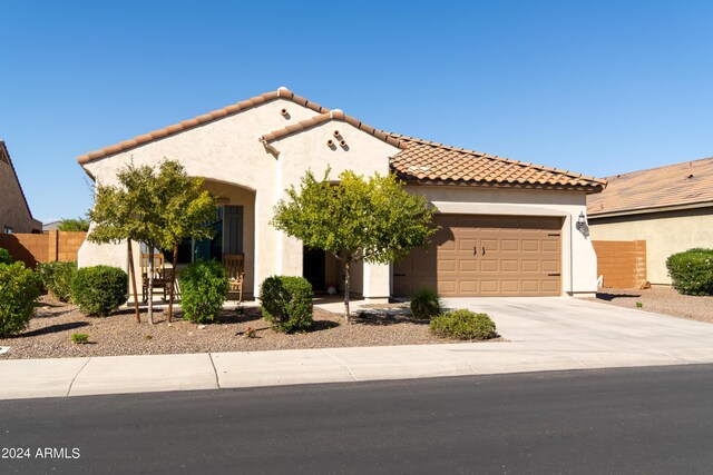 mediterranean / spanish house with a garage