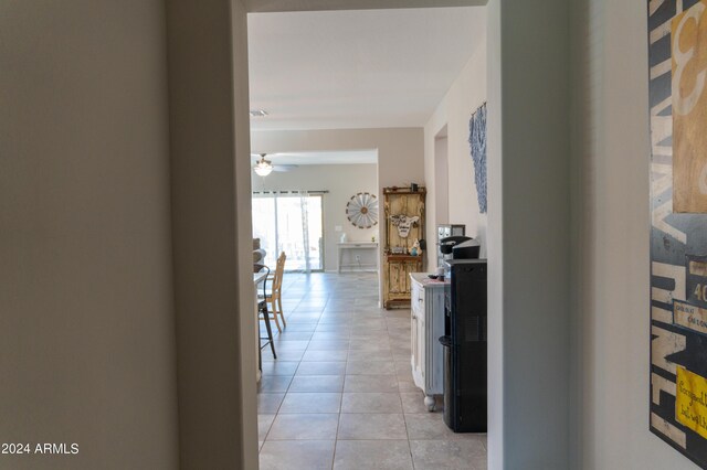 kitchen featuring dishwasher, sink, hanging light fixtures, a kitchen breakfast bar, and ceiling fan