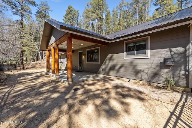 view of side of property featuring a patio area