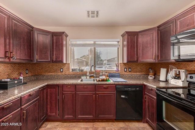 1507 W Mesquite Ave, Apache Junction, AZ 85120 - kitchen with black appliances, a sink, reddish brown cabinets, and decorative backsplash