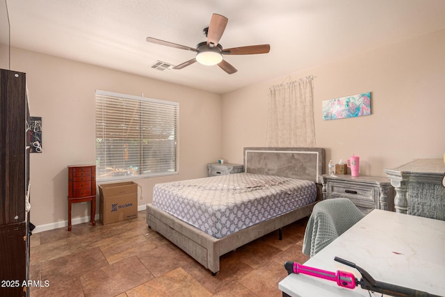 1507 W Mesquite Ave, Apache Junction, AZ 85120 - bedroom featuring baseboards, stone finish flooring, and a ceiling fan