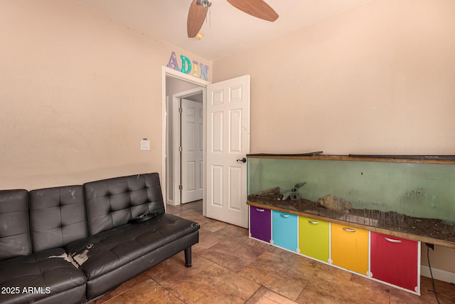 1507 W Mesquite Ave, Apache Junction, AZ 85120 - living area with ceiling fan, baseboards, and stone finish floors