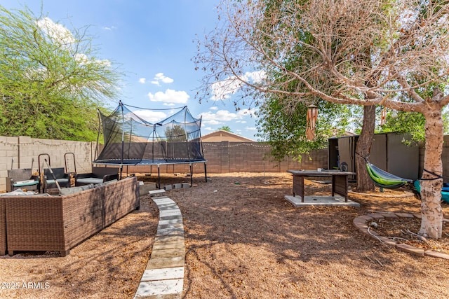 1507 W Mesquite Ave, Apache Junction, AZ 85120 - fenced backyard featuring a trampoline