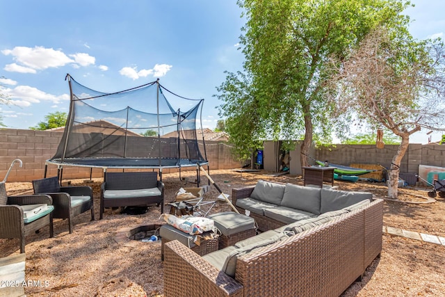 1507 W Mesquite Ave, Apache Junction, AZ 85120 - fenced backyard with a trampoline and outdoor lounge area
