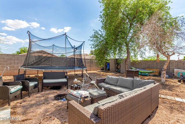 1507 W Mesquite Ave, Apache Junction, AZ 85120 - fenced backyard with a trampoline and outdoor lounge area