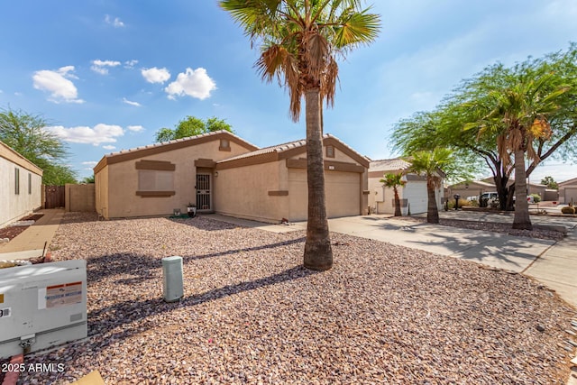 1507 W Mesquite Ave, Apache Junction, AZ 85120 - view of front of property with concrete driveway, stucco siding, a garage, and a tiled roof