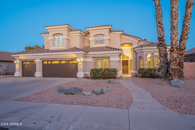 1663 S Boulder St, Gilbert, AZ 85295 - mediterranean / spanish-style home featuring stucco siding, concrete driveway, an attached garage, and a tiled roof