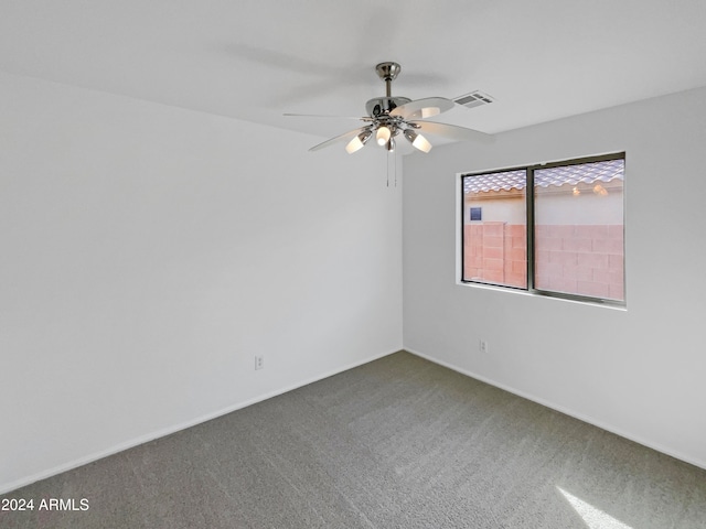 carpeted empty room with ceiling fan