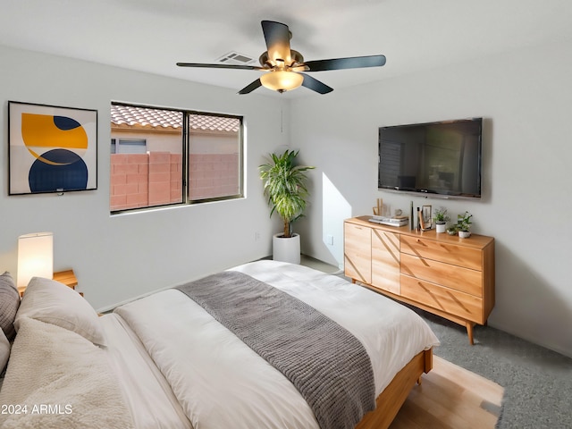 bedroom featuring ceiling fan and light colored carpet