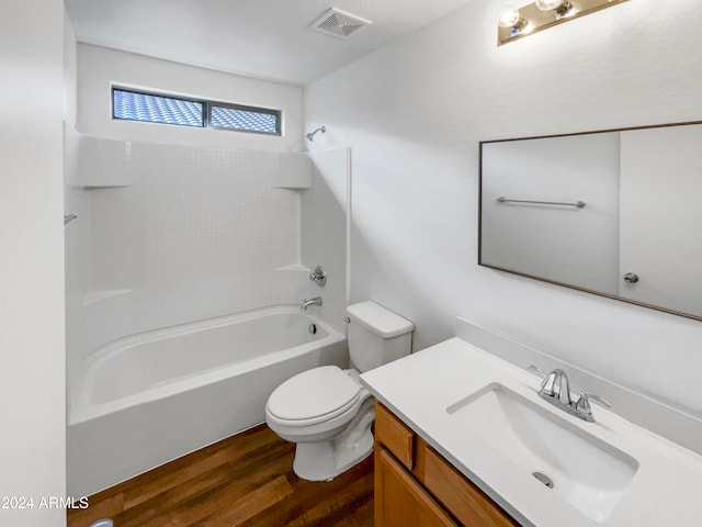 full bathroom featuring hardwood / wood-style flooring, shower / tub combination, vanity, and toilet