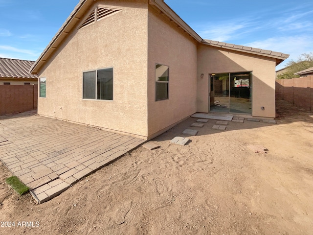 rear view of house featuring a patio