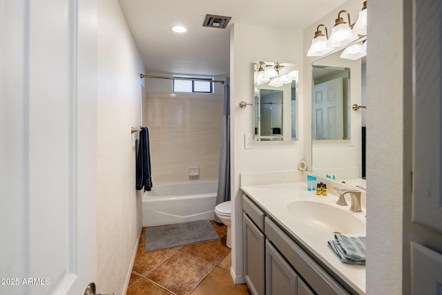 full bathroom with tile patterned flooring, shower / bath combo, vanity, and toilet