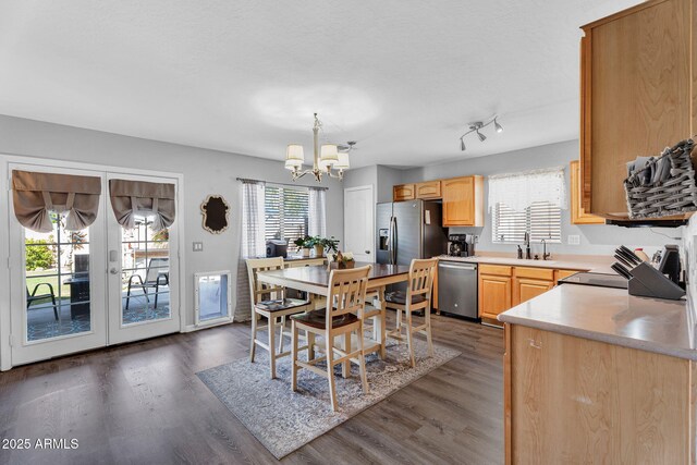 2412 W Camp River Rd, San Tan Valley, AZ 85144 - dining space with a notable chandelier, french doors, and dark wood-style floors