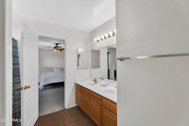2412 W Camp River Rd, San Tan Valley, AZ 85144 - ensuite bathroom with tile patterned floors, a sink, connected bathroom, ceiling fan, and a textured wall