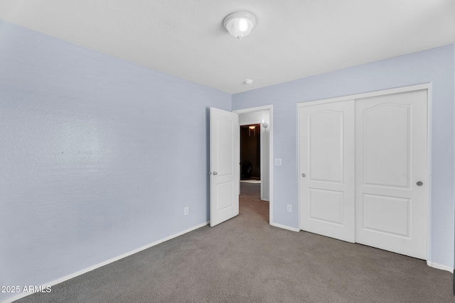 2412 W Camp River Rd, San Tan Valley, AZ 85144 - unfurnished bedroom featuring baseboards, carpet flooring, and a closet