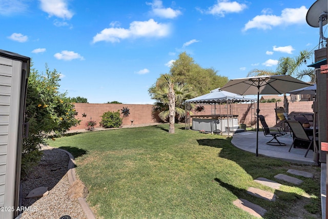 2412 W Camp River Rd, San Tan Valley, AZ 85144 - view of yard with a patio area, a hot tub, and a fenced backyard