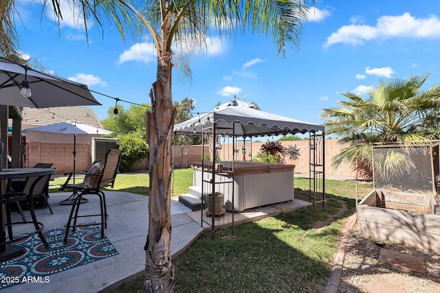 2412 W Camp River Rd, San Tan Valley, AZ 85144 - view of yard featuring a fenced backyard, a gazebo, a hot tub, and a patio area