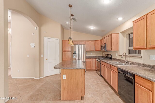 kitchen featuring stainless steel appliances, a sink, vaulted ceiling, a center island, and light brown cabinets