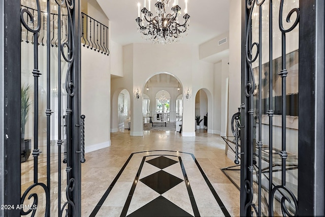 entryway featuring a notable chandelier