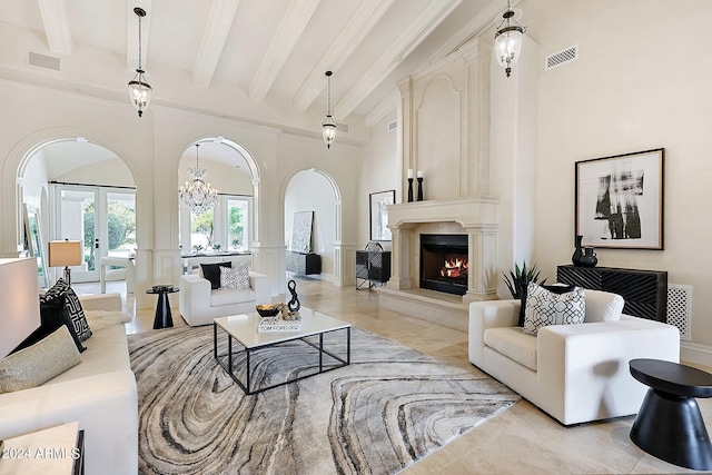 living room featuring beam ceiling, french doors, and a high ceiling